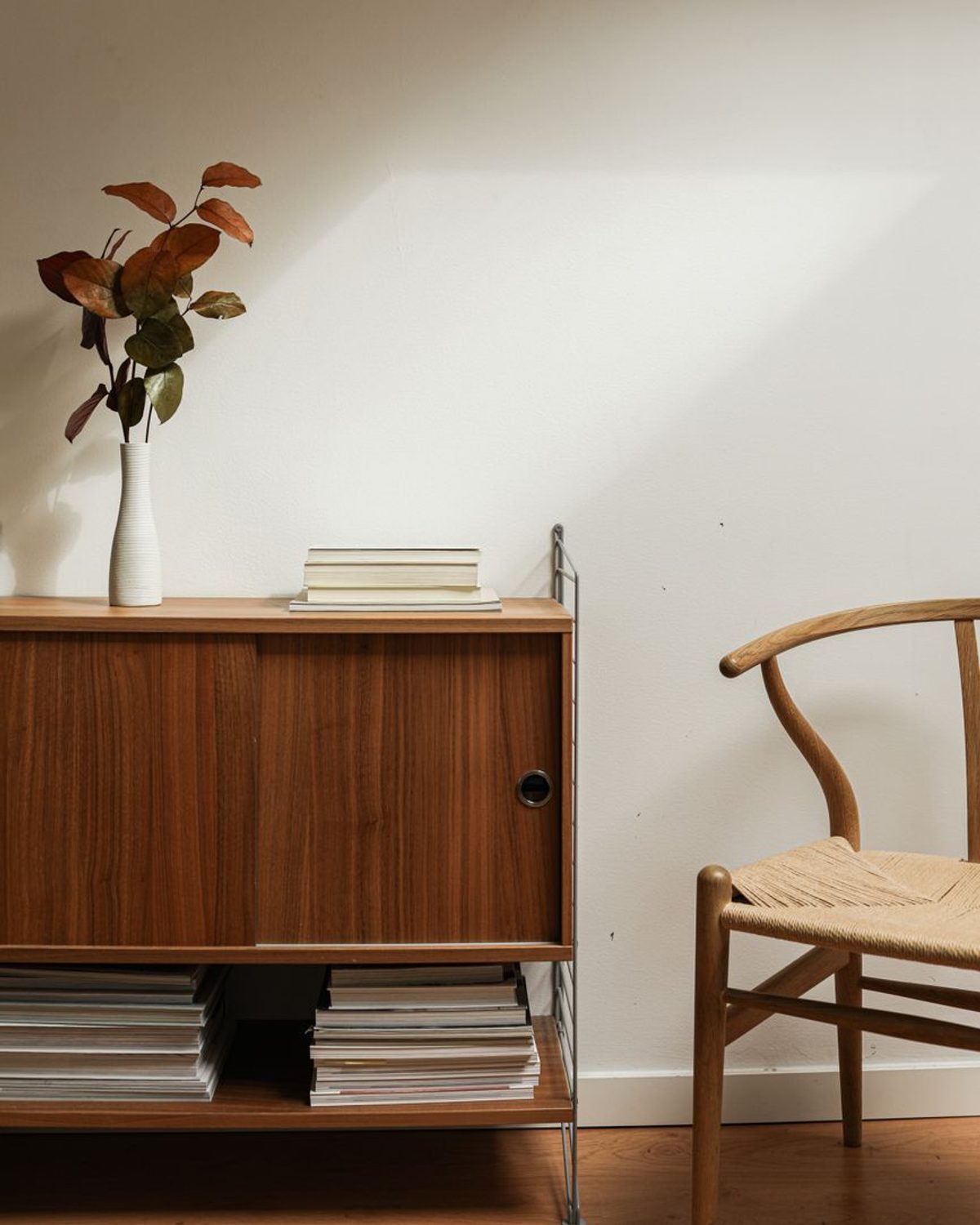Kumo Sideboard in natural oak with brushed brass pulls, three-quarter view on a neutral studio background.