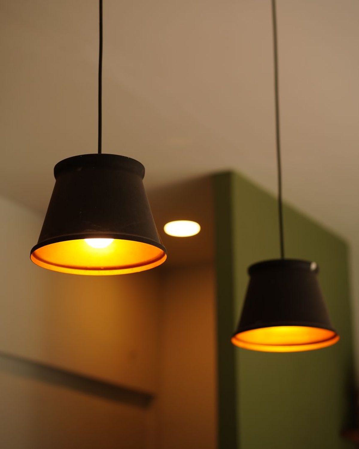 Tsuki Pendant Light in natural washi paper on a blackened-steel frame, lit against a neutral background.